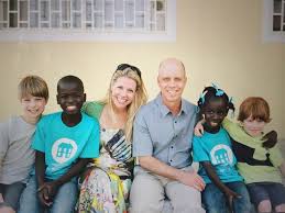 Scott Hamilton with his wife and four children, his two biological sons and a son and daughter adopted from Haiti. 